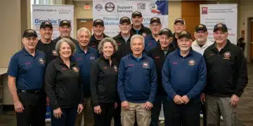 Smiling veterans receiving financial aid information