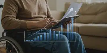 Person with disability reviewing documents on a tablet, symbolizing new disability benefits updates.